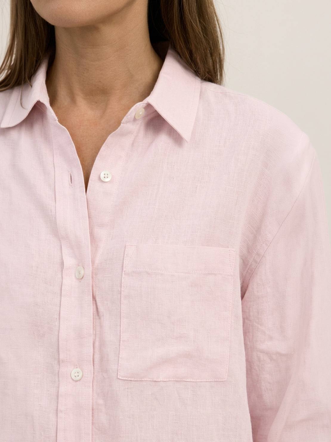 100% linen dropped-shoulder oversized shirt with button front, long rollable sleeves, side slits, and relaxed hip-length cut
