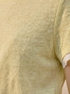100% linen rolled cuff tee with relaxed scoop neckline and contrast lining